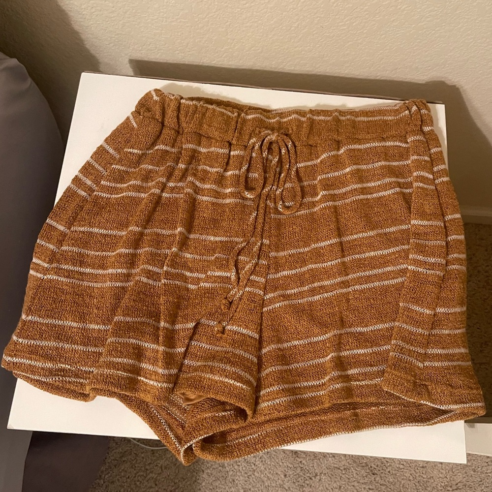 Rust orange shorts with white stripes